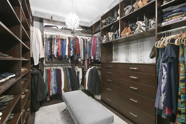 6028 Curie Pl, Palm Beach Gardens, FL 33418 - spacious closet featuring a chandelier