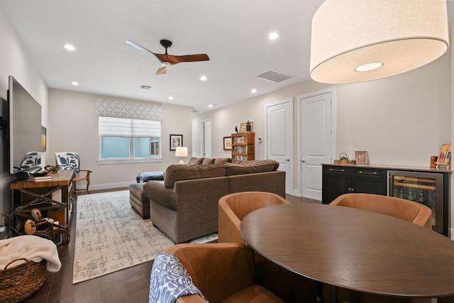6028 Curie Pl, Palm Beach Gardens, FL 33418 - living area featuring wine cooler, ceiling fan, recessed lighting, wood finished floors, and baseboards