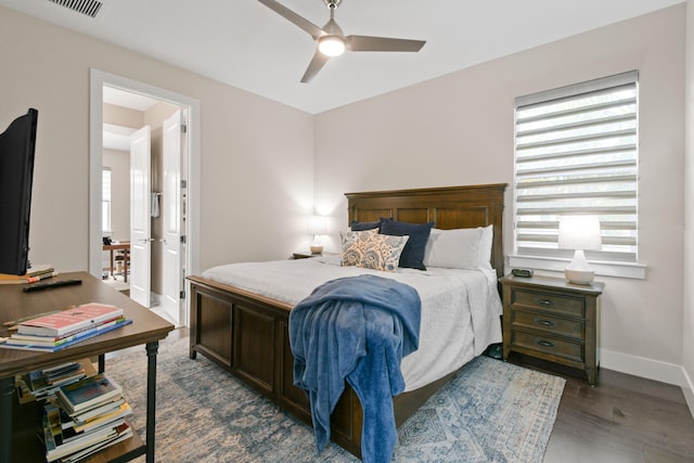 6028 Curie Pl, Palm Beach Gardens, FL 33418 - bedroom with multiple windows, dark wood-style flooring, baseboards, and ceiling fan
