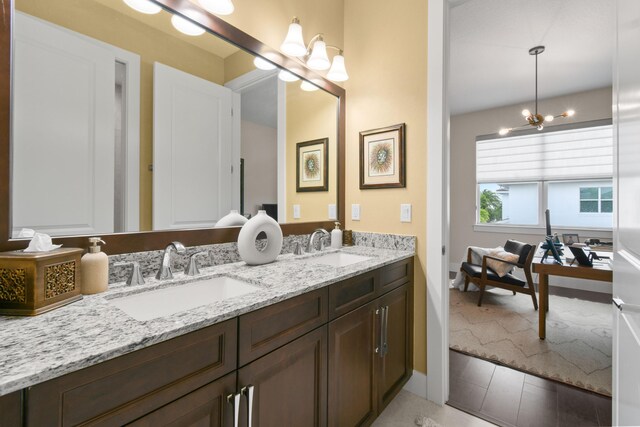 6028 Curie Pl, Palm Beach Gardens, FL 33418 - full bathroom featuring a chandelier and double vanity