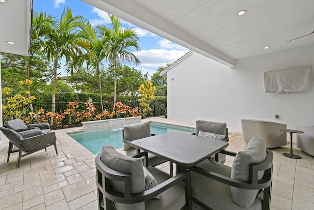 6028 Curie Pl, Palm Beach Gardens, FL 33418 - view of patio / terrace featuring a fenced backyard and outdoor dining space