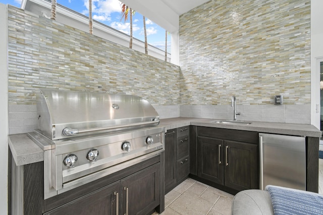 6028 Curie Pl, Palm Beach Gardens, FL 33418 - view of patio with a sink and area for grilling