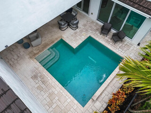 6028 Curie Pl, Palm Beach Gardens, FL 33418 - view of swimming pool featuring a patio area