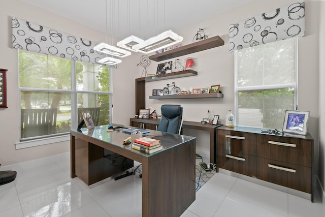 6028 Curie Pl, Palm Beach Gardens, FL 33418 - home office featuring light tile patterned floors and a chandelier