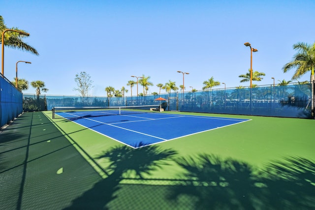 6028 Curie Pl, Palm Beach Gardens, FL 33418 - view of tennis court with fence and community basketball court
