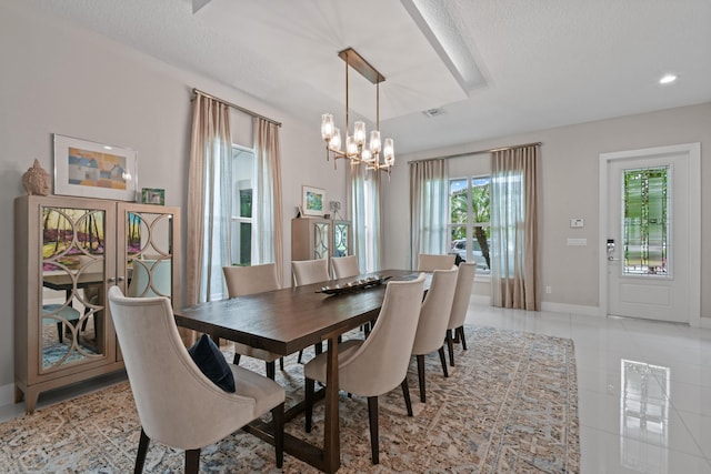 6028 Curie Pl, Palm Beach Gardens, FL 33418 - dining area with a chandelier, baseboards, light tile patterned floors, a textured ceiling, and recessed lighting