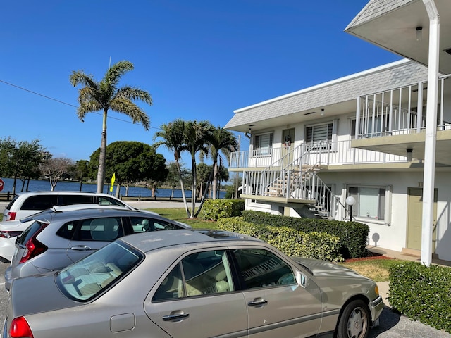 3160 Lake Osborne Dr Unit 201, Lake Worth, FL 33461 - view of parking featuring stairs
