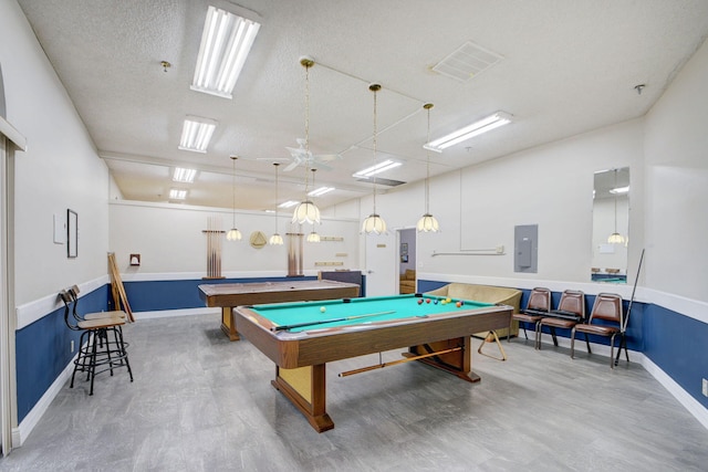 playroom with billiards, ceiling fan, electric panel, wood finished floors, and a textured ceiling