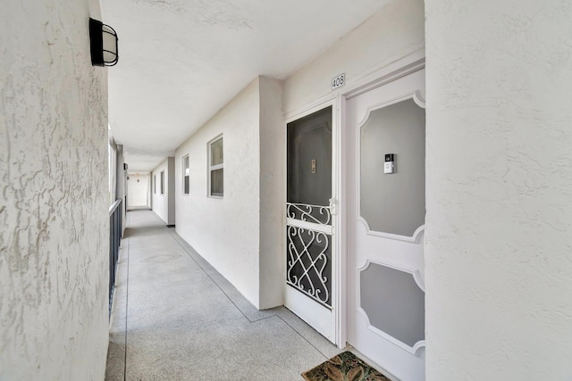 doorway to property with stucco siding