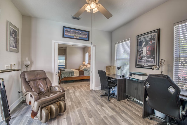 2720 SE Kern Rd, Port Saint Lucie, FL 34984 - office with ceiling fan, light wood-type flooring, healthy amount of natural light, and baseboards