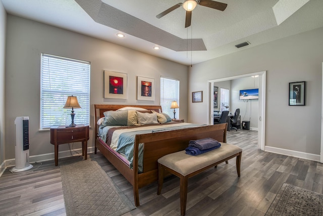 2720 SE Kern Rd, Port Saint Lucie, FL 34984 - bedroom with wood finished floors, baseboards, a desk, a raised ceiling, and recessed lighting