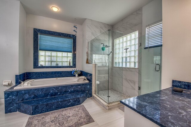 2720 SE Kern Rd, Port Saint Lucie, FL 34984 - bathroom with plenty of natural light, a shower stall, a bath, and vanity