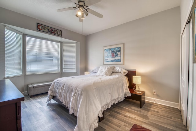 2720 SE Kern Rd, Port Saint Lucie, FL 34984 - bedroom with baseboards, wood finished floors, and a ceiling fan