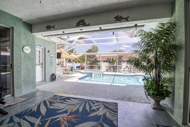 2720 SE Kern Rd, Port Saint Lucie, FL 34984 - view of swimming pool featuring a patio, a pool with connected hot tub, and a lanai