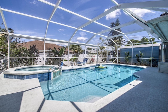 2720 SE Kern Rd, Port Saint Lucie, FL 34984 - view of swimming pool featuring a shed, an outbuilding, a patio, a pool with connected hot tub, and glass enclosure
