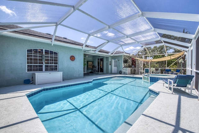 2720 SE Kern Rd, Port Saint Lucie, FL 34984 - view of pool with a patio, a lanai, and a pool with connected hot tub