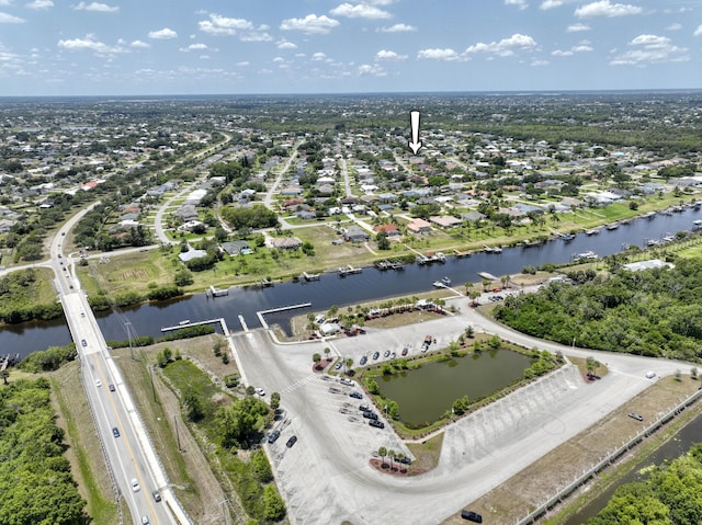2720 SE Kern Rd, Port Saint Lucie, FL 34984 - aerial view of property's location featuring a large body of water and nearby suburban area