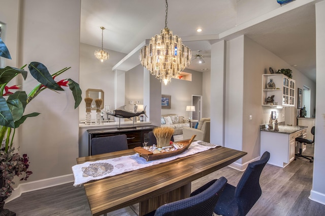 2720 SE Kern Rd, Port Saint Lucie, FL 34984 - dining room featuring a chandelier, wood finished floors, and baseboards