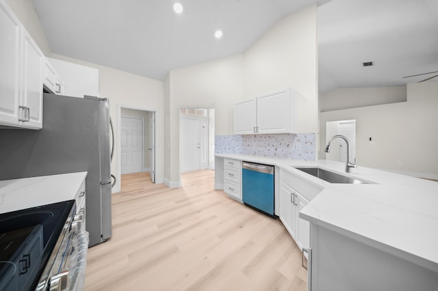 3227 SW Foremost Dr, Port Saint Lucie, FL 34953 - kitchen featuring dishwasher, a sink, lofted ceiling, electric range, and light wood-style floors