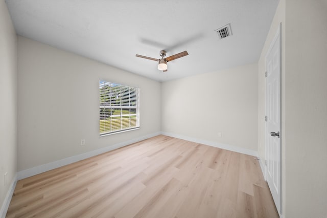 3227 SW Foremost Dr, Port Saint Lucie, FL 34953 - spare room featuring wood finished floors, a ceiling fan, and baseboards