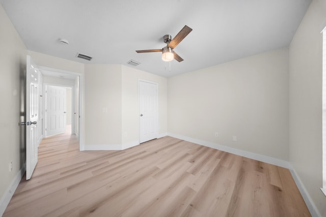 3227 SW Foremost Dr, Port Saint Lucie, FL 34953 - unfurnished bedroom with light wood finished floors, baseboards, and ceiling fan