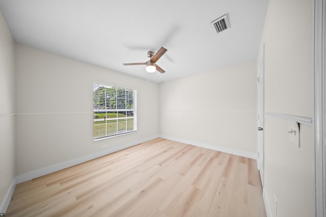 3227 SW Foremost Dr, Port Saint Lucie, FL 34953 - empty room featuring wood finished floors, a ceiling fan, and baseboards