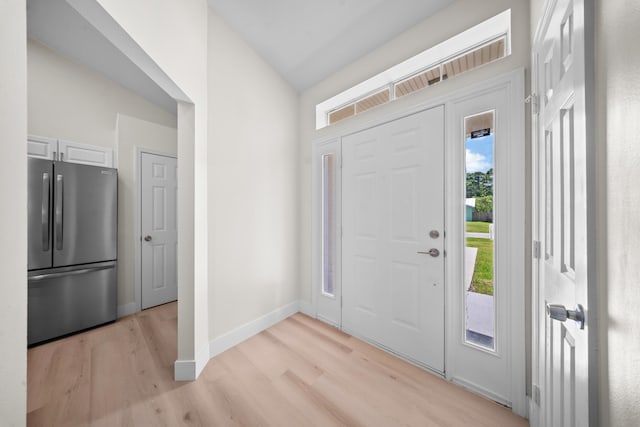 3227 SW Foremost Dr, Port Saint Lucie, FL 34953 - foyer entrance featuring light wood-style floors and baseboards