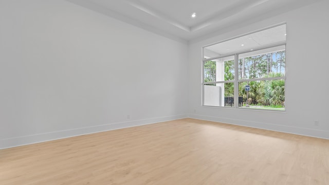unfurnished room featuring light wood-style floors, baseboards, and recessed lighting