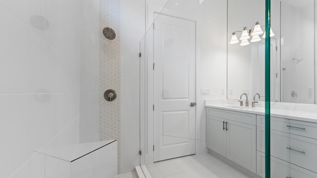 bathroom featuring walk in shower and vanity