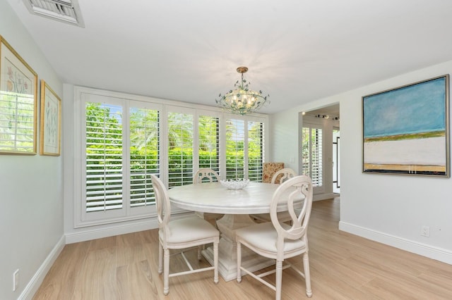 4078 Quail Ridge Dr N Unit A, Boynton Beach, FL 33436 - dining room with light wood-style floors, a chandelier, and baseboards