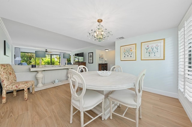 4078 Quail Ridge Dr N Unit A, Boynton Beach, FL 33436 - dining room with a chandelier, light wood-style flooring, baseboards, and ornamental molding