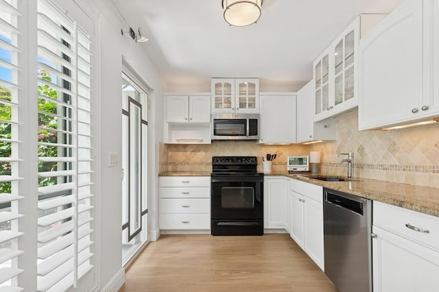 4078 Quail Ridge Dr N Unit A, Boynton Beach, FL 33436 - kitchen with stainless steel appliances, a sink, decorative backsplash, and light stone countertops