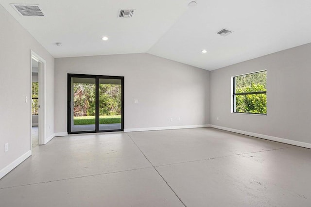 6728 Spanish Lake Blvd, Fort Pierce, FL 34951 - unfurnished room featuring baseboards, plenty of natural light, finished concrete floors, lofted ceiling, and recessed lighting