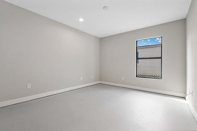 6728 Spanish Lake Blvd, Fort Pierce, FL 34951 - spare room featuring concrete floors, baseboards, and recessed lighting