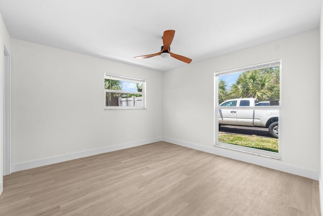 4498 NW 2nd Ave, Boca Raton, FL 33431 - spare room featuring light wood-style floors, baseboards, and a ceiling fan