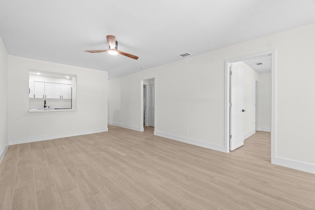 4498 NW 2nd Ave, Boca Raton, FL 33431 - unfurnished living room featuring ceiling fan, light wood finished floors, and baseboards