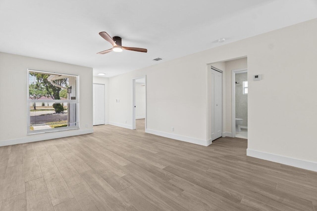 4498 NW 2nd Ave, Boca Raton, FL 33431 - unfurnished living room with light wood-type flooring, a ceiling fan, and baseboards