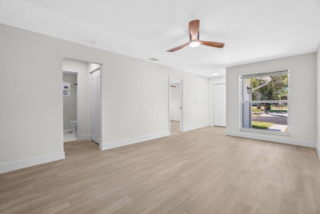 4498 NW 2nd Ave, Boca Raton, FL 33431 - unfurnished living room featuring light wood-style floors, a ceiling fan, and baseboards