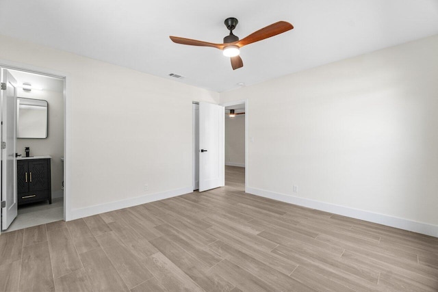 4498 NW 2nd Ave, Boca Raton, FL 33431 - unfurnished bedroom featuring light wood finished floors, baseboards, and ensuite bathroom
