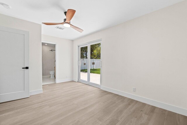4498 NW 2nd Ave, Boca Raton, FL 33431 - unfurnished bedroom with access to outside, light wood-style floors, baseboards, ensuite bathroom, and ceiling fan