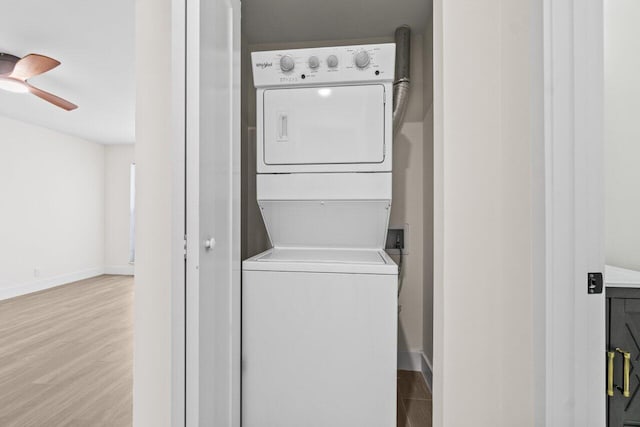 4498 NW 2nd Ave, Boca Raton, FL 33431 - washroom with stacked washer / drying machine, wood finished floors, ceiling fan, and baseboards