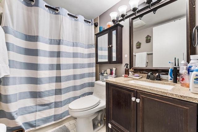 bathroom with toilet, vanity, tile patterned flooring, and a shower with curtain