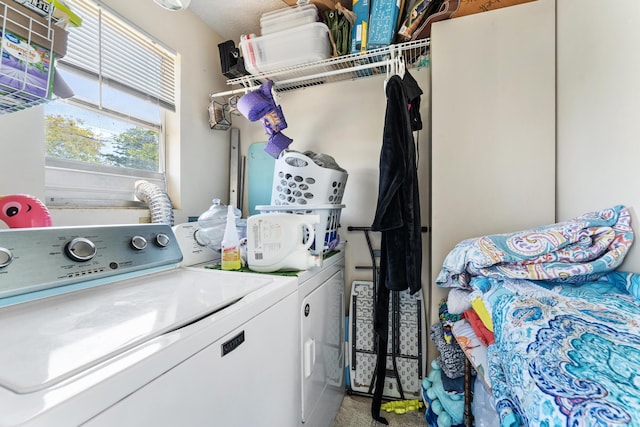laundry area with washing machine and clothes dryer