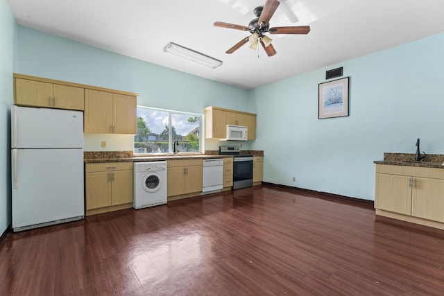 kitchen featuring white appliances, washer / clothes dryer, light brown cabinets, dark wood finished floors, and ceiling fan