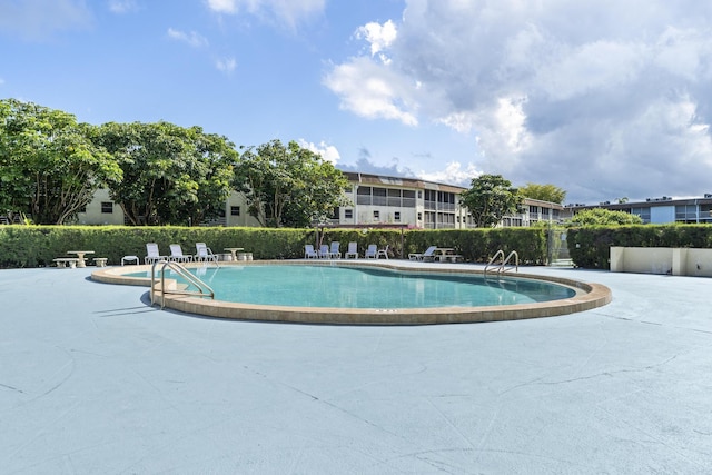 community pool featuring a patio area