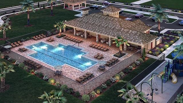 view of subject property featuring a pool
