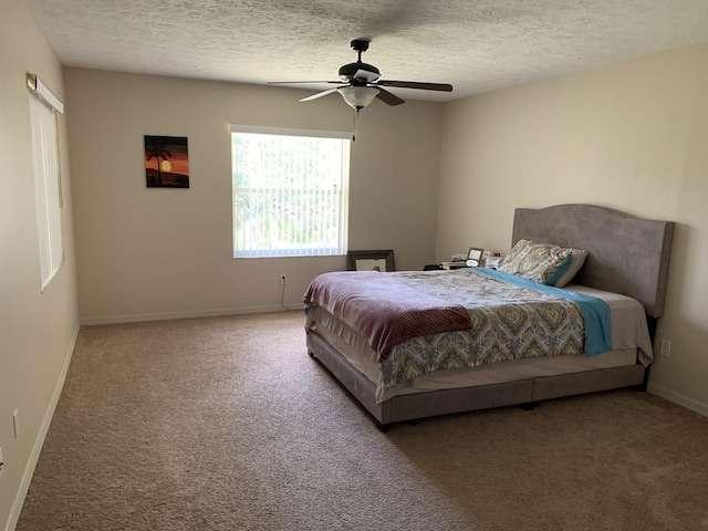1472 SW Melrose Ave, Port Saint Lucie, FL 34953 - bedroom featuring carpet flooring, baseboards, a textured ceiling, and ceiling fan