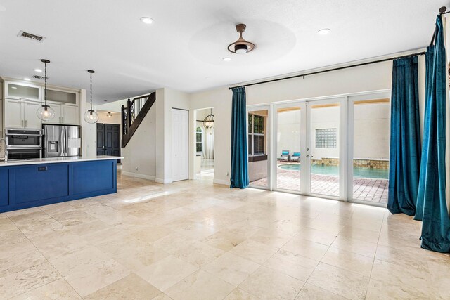 4205 Artesa Dr, Boynton Beach, FL 33436 - unfurnished living room with french doors, recessed lighting, and baseboards