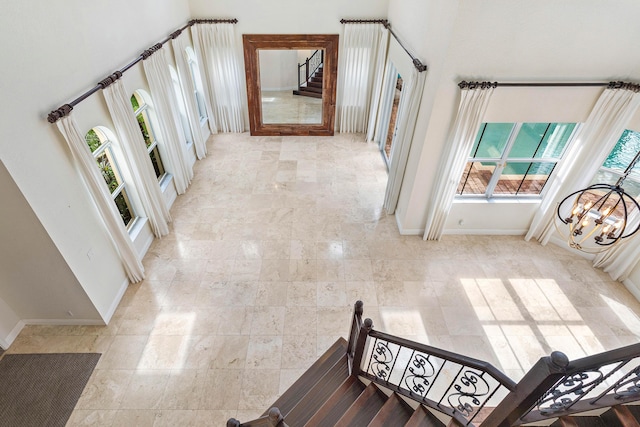 4205 Artesa Dr, Boynton Beach, FL 33436 - corridor featuring plenty of natural light, stairway, baseboards, and a towering ceiling