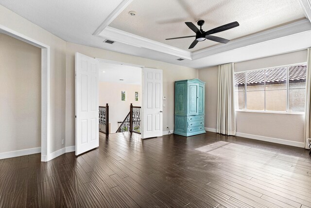 4205 Artesa Dr, Boynton Beach, FL 33436 - empty room featuring a tray ceiling, ornamental molding, ceiling fan, dark wood-style flooring, and baseboards